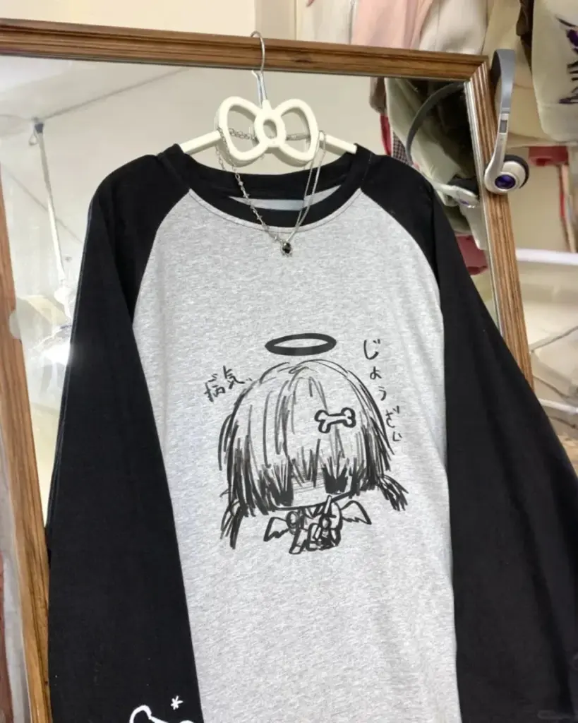 Gray animecore sweatshirt with a drawn character design.