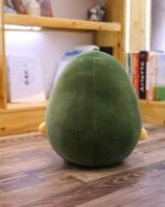 Green kawaii avocado plushie, soft and cuddly toy with cute ears.
