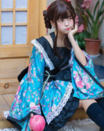 Blue harajuku aesthetic kimono with floral embroidery and lace trim, worn by a model.