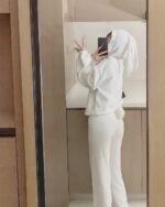 Person wearing fluffy bunny pajamas, soft girl aesthetic.