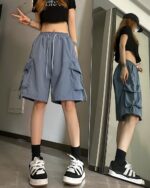 Blue Korean aesthetic shorts with cargo pockets, worn by two individuals.