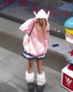 Person wearing a Loose Thick Feathered Hoodie - Harajuku Aesthetic, featuring a pink hooded jacket and accessories.