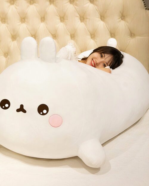Large white molang bunny plushie, kawaii stuffed animal with smiling face.