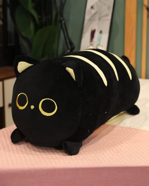 Black chonky loaf plushie with yellow eyes and stripes, soft fabric.