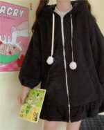 Black fluffy bunny ears coat with pom-poms, hooded sweatshirt.