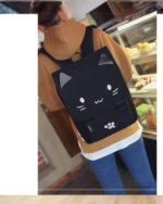 Black kawaii neko backpack featuring cat ears and paw details. School edition.