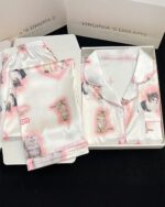 Kitty silky pajamas set in a box, featuring cat illustrations and sleepwear.