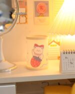 Kawaii pen holder featuring a cute animal design with a strawberry.