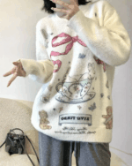 Kawaii rabbit sweater featuring rabbits, teacups, and bears on a knit fabric.