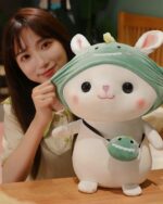 Kawaii bunny plushie, Cotton the Adventurous Rabbit, resting on a table with a woman.