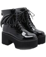 Black gothic leather boots with platform sole and decorative wings.