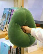 Close-up of a green kawaii avocado plushie, soft and plump.
