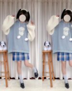 Kawaii Lolita Lamb Hoodie worn by a person with blue plaid skirt and plush lamb toys.