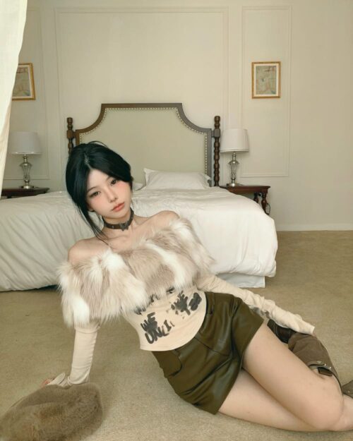 Short fluffy top in y2k aesthetic, featuring faux fur and graphic print.