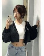 Black korean aesthetic hoodie worn by a woman in a bathroom selfie.