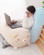 Kawaii animal mochi plushie, a pig-shaped pillow with a laptop.