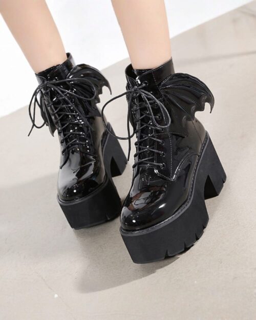 Black Gothic leather boots with platform soles and laces.