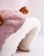 Close-up of a Cute and Fluffy Reindeer Winter Hat featuring plush reindeer details and a white fur lining.