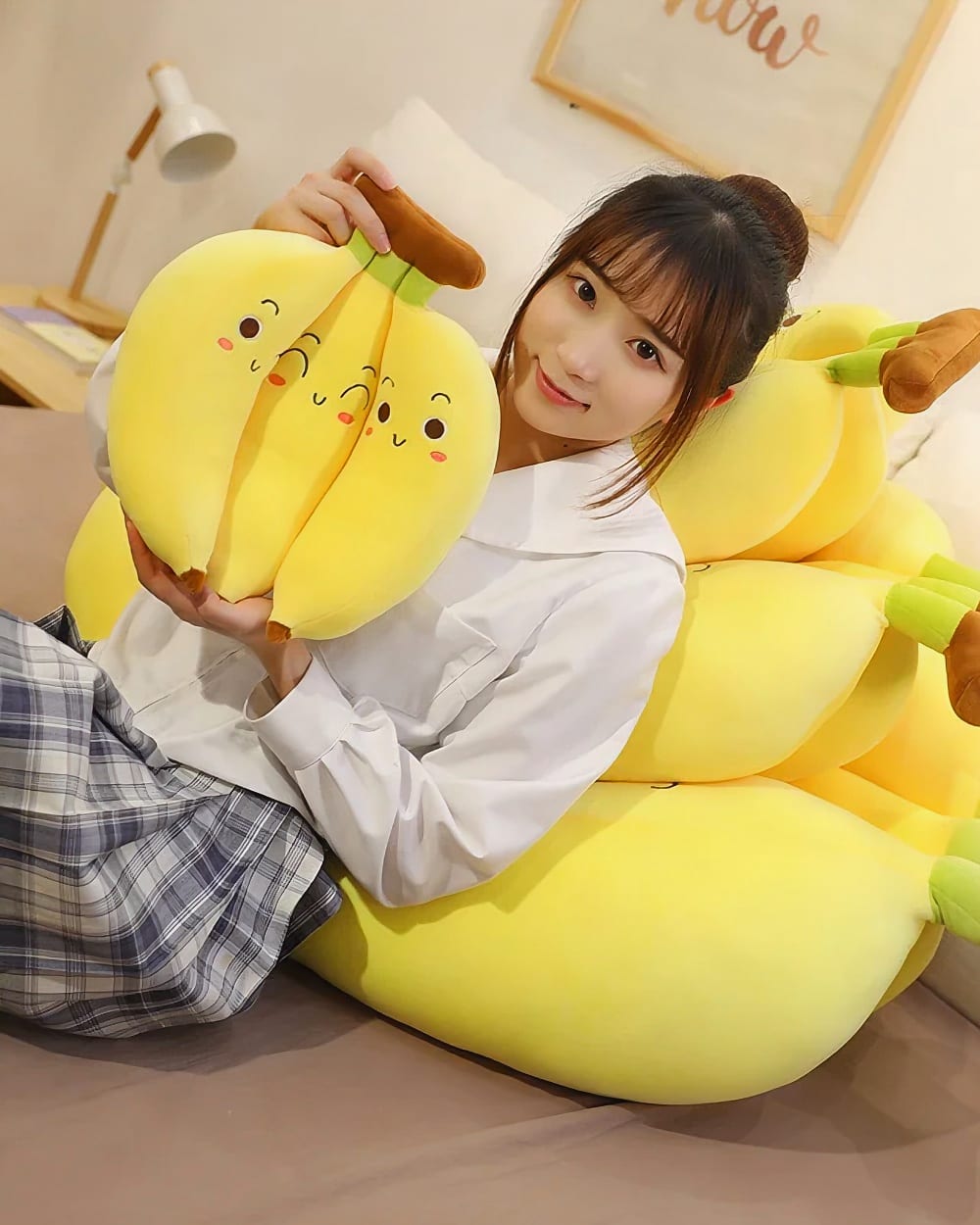 Cute banana plushies - three pack edition, featuring smiling plush bananas with brown stems.