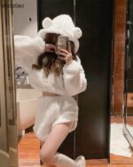 Person wearing white bear pajamas, a cozy kawaii clothes set.