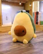 A soft, yellow Kawaii avocado plushie with brown details and a cute expression.