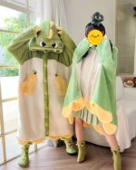 Two kawaii animal nightgowns - one green dinosaur and one yellow dinosaur, made of coral fleece.