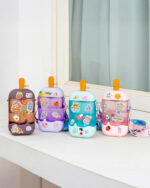 Set of kawaii ice cream water bottles with various character stickers.