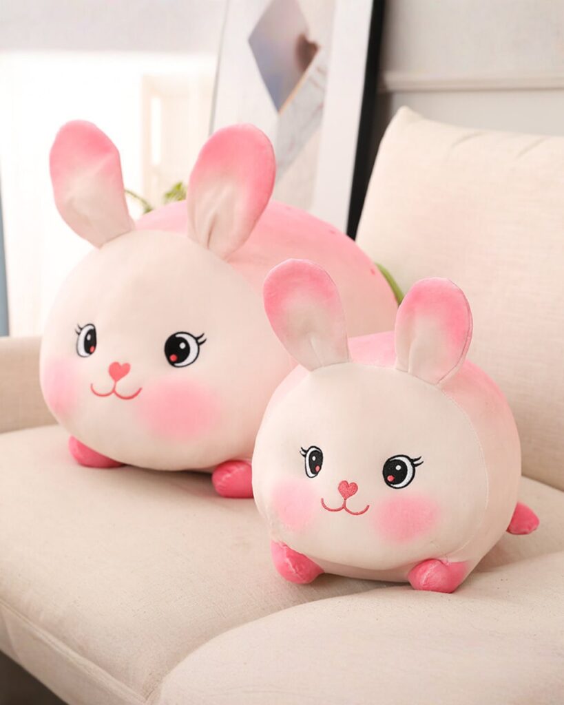 Kawaii strawberry bunny plushie, soft plush toy with pink details and cute face.