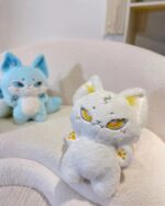 Kawaii little kitsune fox plushie, soft white and blue plush toy with big eyes.