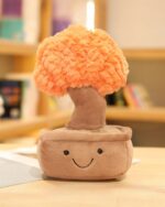 Close-up of a plush potted tree, Pachira Edition. Cute, soft plush with a leafy top.