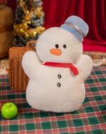 Small, fluffy white christmas chonky plushies with a hat, buttons, and rosy cheeks.