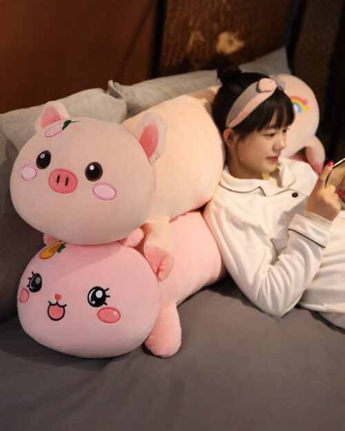 Pink kawaii sleeping pillow featuring a cute pig design, soft plush toy.