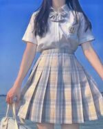 Light beige jk plaid skirt with pleats, part of a kawaii school outfit.