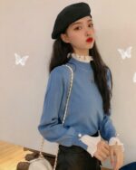 Blue french aesthetic top with ruffled detailing and a beret.