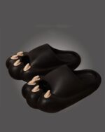 Black cat paw thick sandals, featuring oversized foot-shaped design. Kawaii Home cat paw sandals.