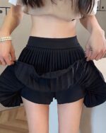 Black coquette aesthetic skirt, pleated style with gathered ruffles.