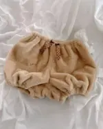 Brown fluffy kawaii bear pajamas with a polka dot bow.