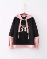 Black sakura bunny hoodie with pink sleeves, featuring embroidered bunnies and tassels.