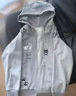 Grey cat paw hoodie featuring cat and star embroidery, Harajuku aesthetic design.