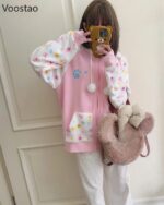 Pink harajuku hoodie featuring cute animal prints and plush details. Yume Kawaii aesthetic.