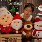 Christmas plushie decor assortment featuring Santa, snowman, and reindeer plush toys.