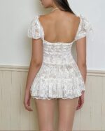 White coquette mesh dress with puff sleeves and a fitted bodice. Floral princess dress style.
