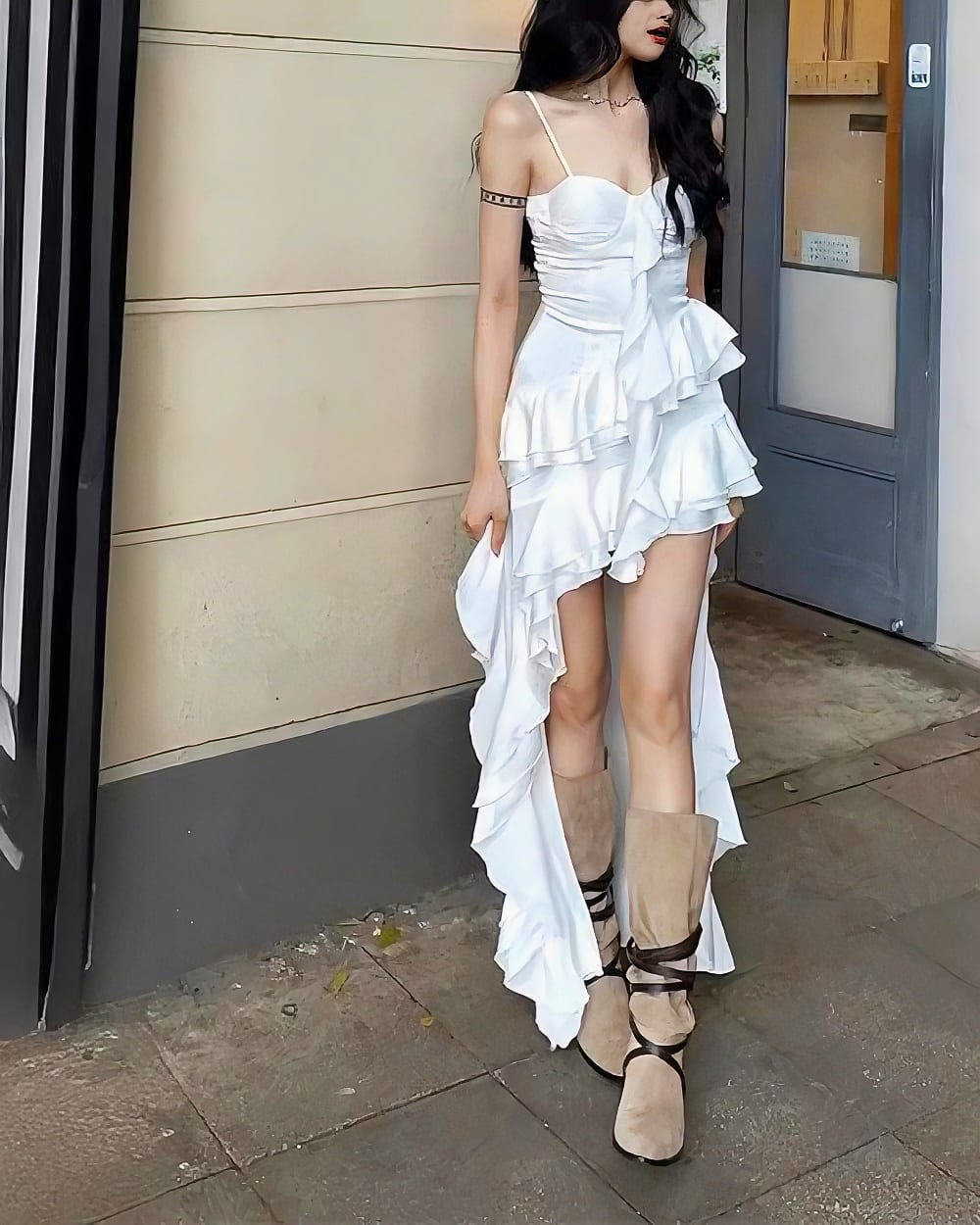 White ruffled sling dress, a coquette aesthetic dress, with a high slit and open back.