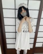 Model wearing a white kawaii loose t-shirt with a graphic print.