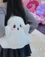 White ghost plushie backpack featuring floppy ears and a cute face.