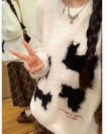 White kitten sweater with black paw print design, kawaii clothes.