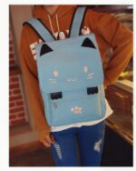 Light blue kawaii neko backpack featuring cat ears and paw prints, ideal for school.