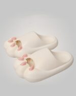 Close-up of beige cat paw sandals, featuring a thick sole and padded footbed. These cat paw sandals are comfortable and cute.