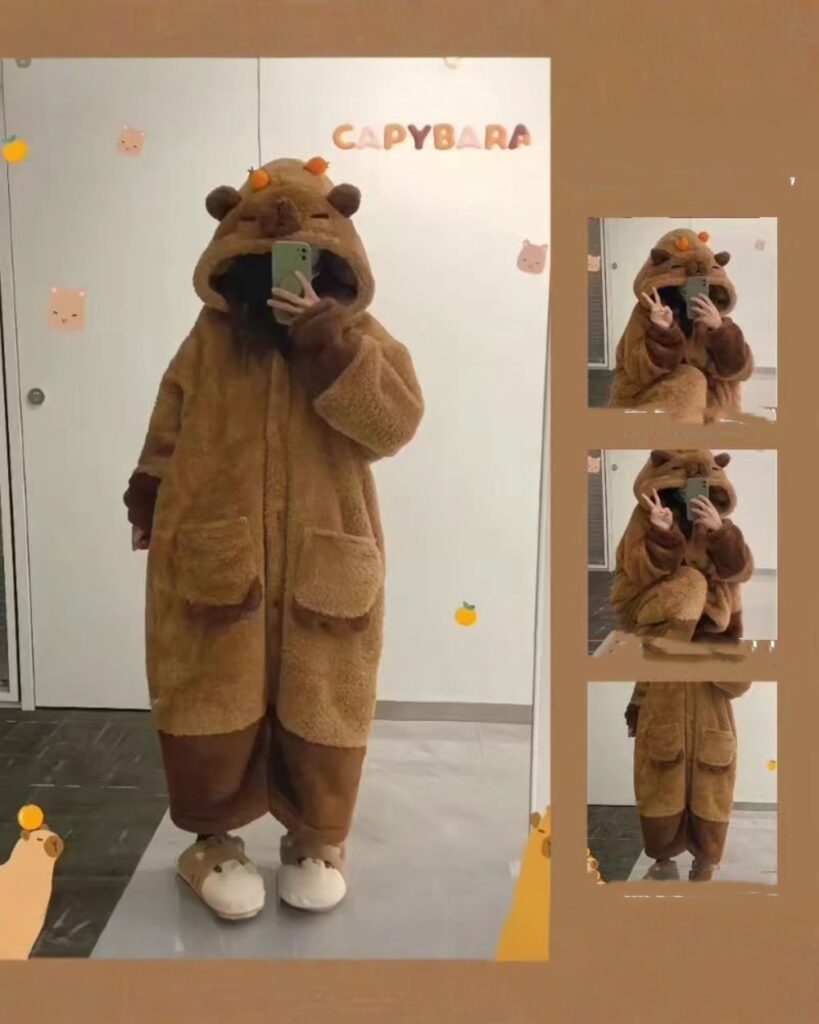 Person wearing brown kawaii animal pajamas, fluffy winter clothes, featuring a bear design.