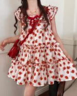 Lolita apple dress in a red and white floral print, featuring ruffles and a bow detail.